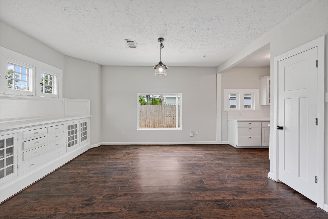 5401 North Capitol Street Houston, TX 77011 - Photo 18 of 39 a view of an empty room with window and wooden floor
