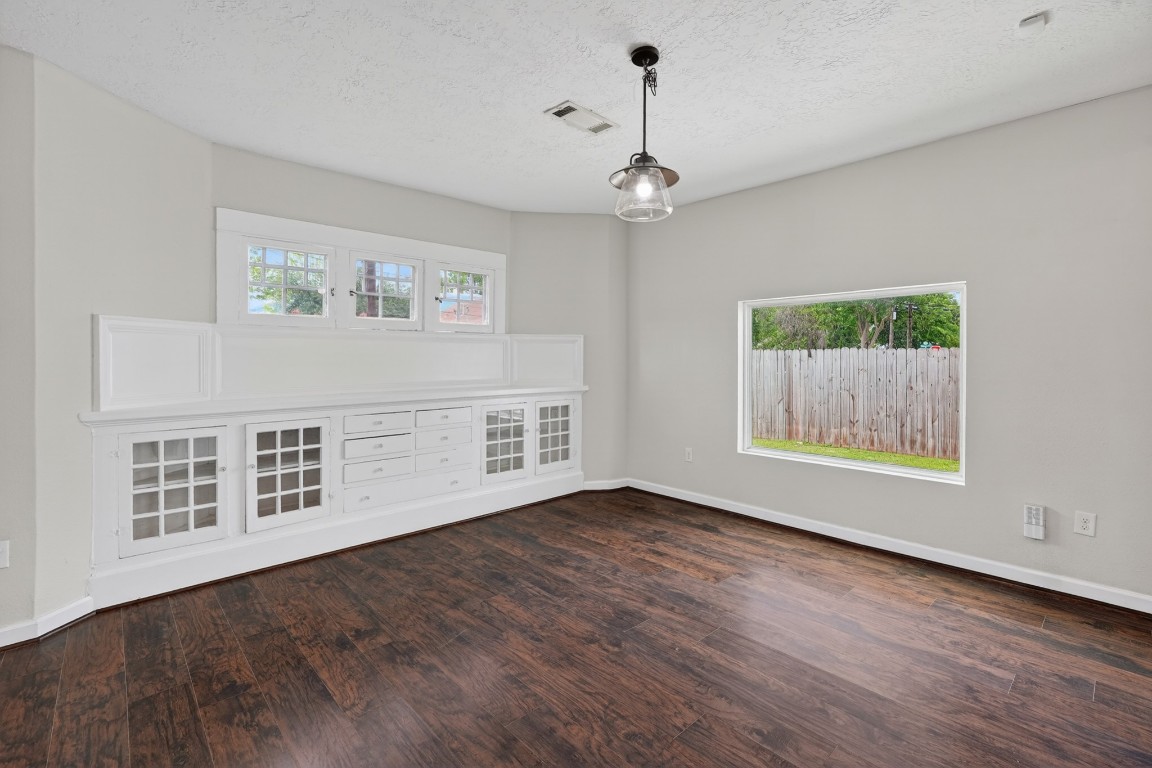 5401 North Capitol Street Houston, TX 77011 - Photo 19 of 39 a view of an empty room with wooden floor and a window
