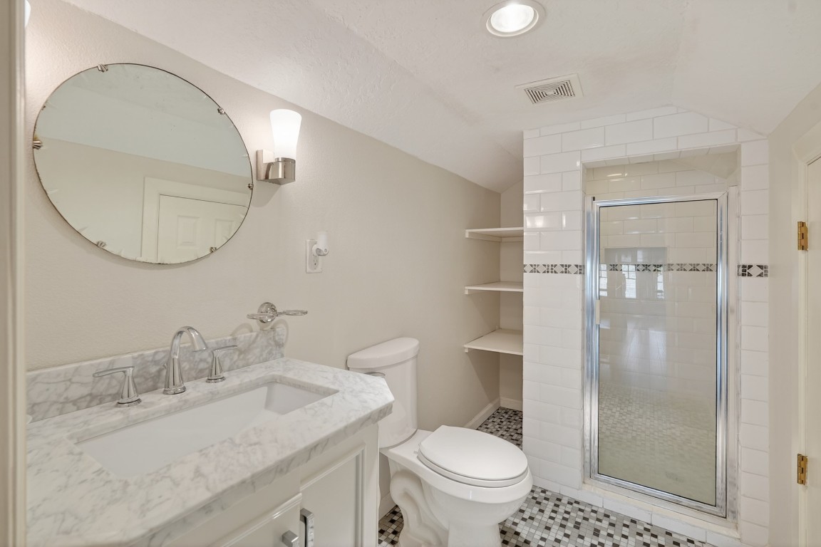5401 North Capitol Street Houston, TX 77011 - Photo 33 of 39 a bathroom with a granite countertop sink toilet and shower
