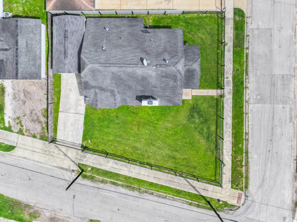 5401 North Capitol Street Houston, TX 77011 - Photo 38 of 39 a aerial view of a house with a yard and a fence