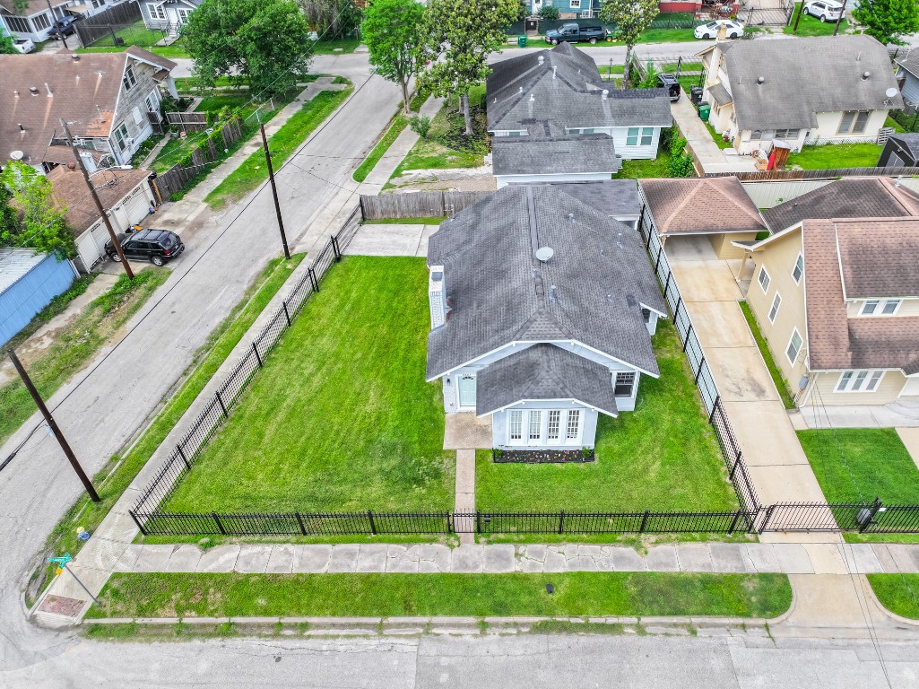 5401 North Capitol Street Houston, TX 77011 - Photo 5 of 39 an aerial view of a house with a yard and potted plants