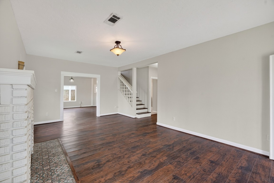 5401 North Capitol Street Houston, TX 77011 - Photo 9 of 39 wooden floor in an empty room with a window