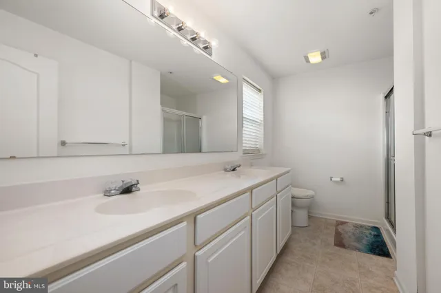 a room with a table and a chandelier