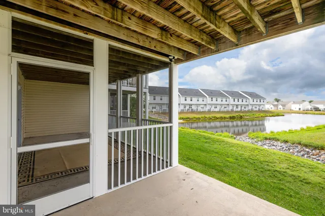 a view of a house with swimming pool and sitting area