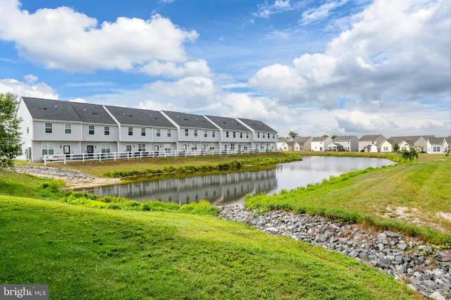 a view of a swimming pool with an ocean view