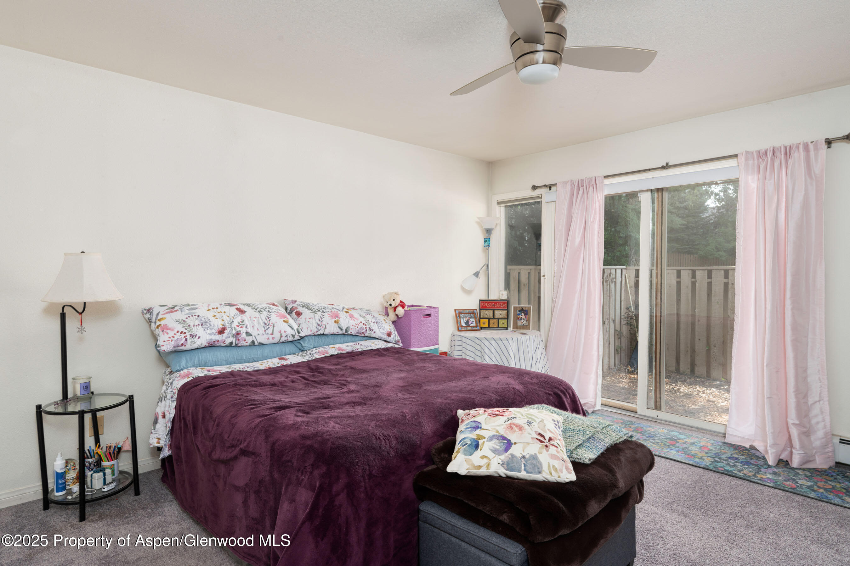 1506 Mockingbird Lane, Unit 11A Basalt, CO 81621 - Photo 4 of 8 a bed sitting in a bedroom next to a window