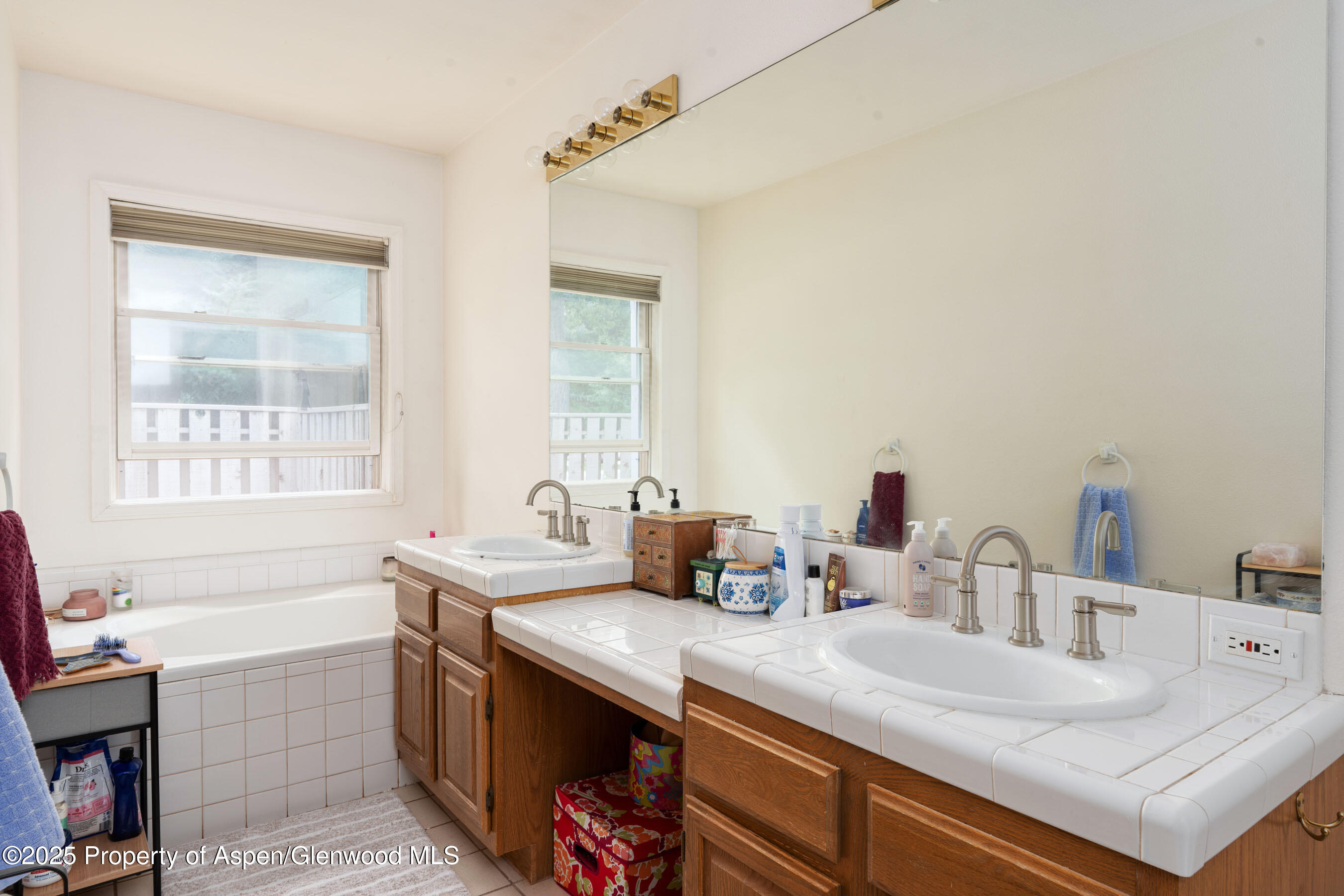 1506 Mockingbird Lane, Unit 11A Basalt, CO 81621 - Photo 5 of 8 a bathroom with a sink double vanity and a bathtub