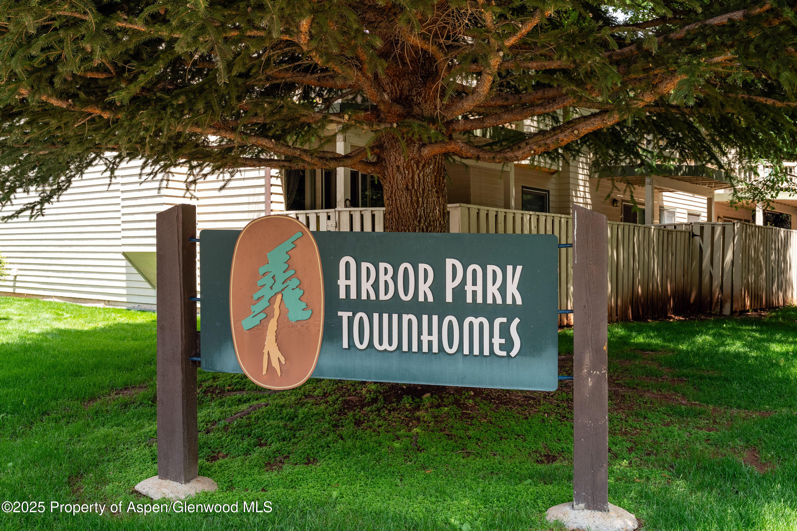 1506 Mockingbird Lane, Unit 11A Basalt, CO 81621 - Photo 6 of 8 a view of a chair and table in backyard of the house