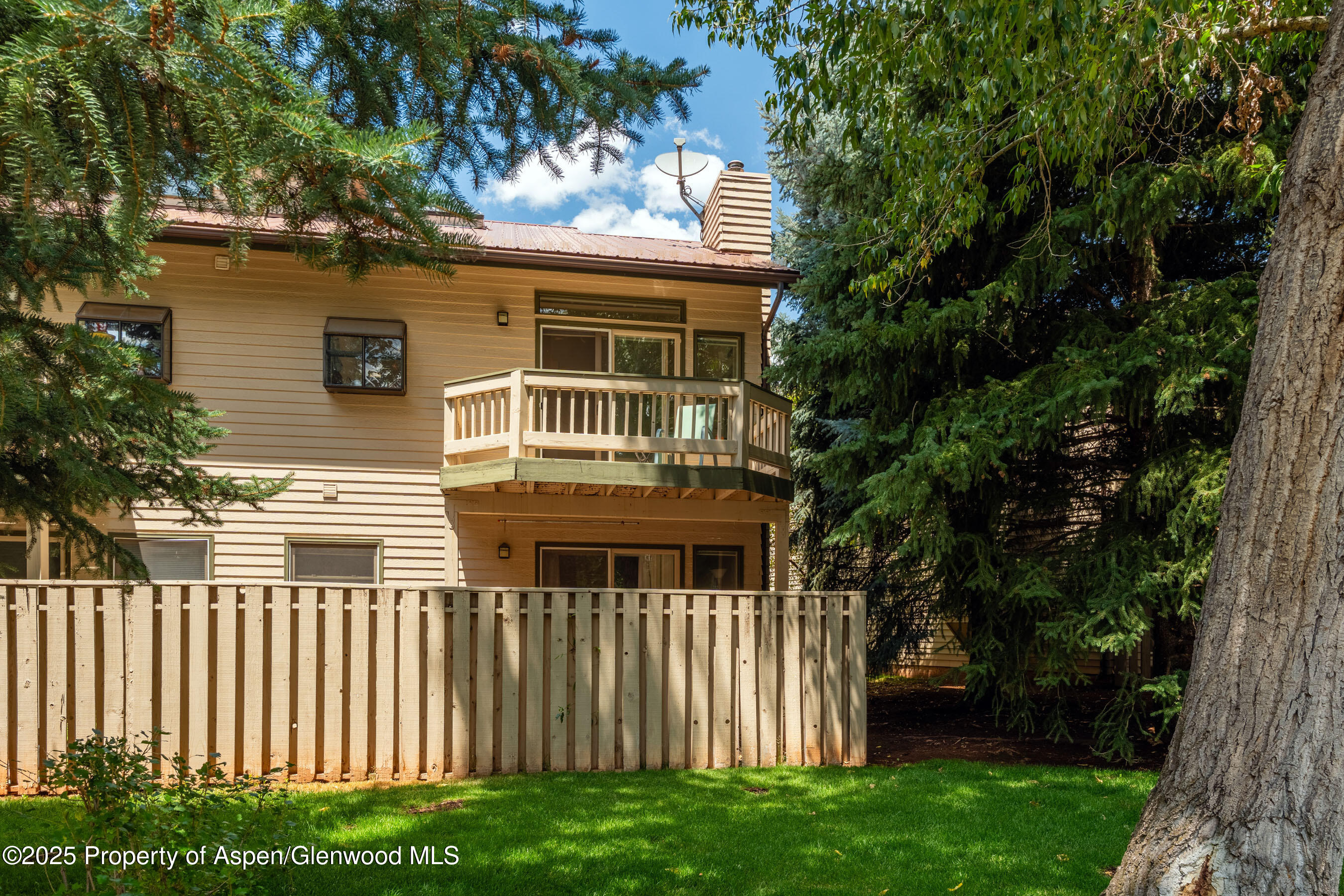 1506 Mockingbird Lane, Unit 11A Basalt, CO 81621 - Photo 7 of 8 a front view of a house with a garden