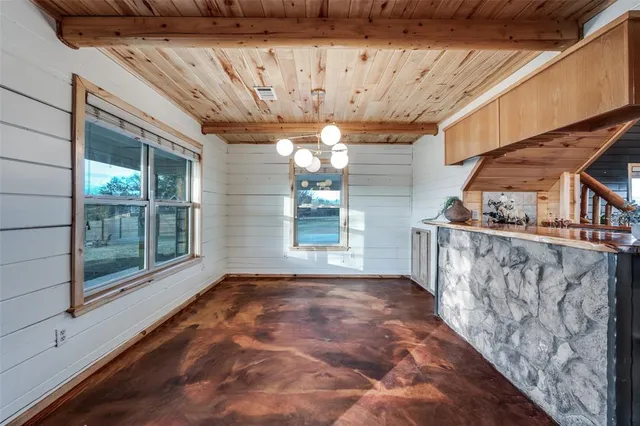 a large kitchen with stainless steel appliances granite countertop lots of counter top space