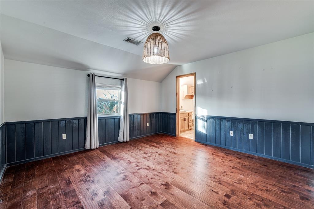 1353 Spring Creek Road Collinsville, TX 76233 - Photo 23 of 40 a view of a livingroom with a chandelier