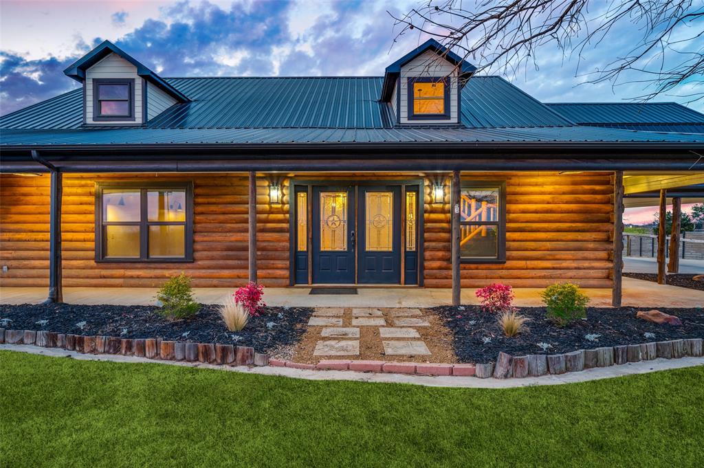 1353 Spring Creek Road Collinsville, TX 76233 - Photo 6 of 40 a front view of house with yard and outdoor seating