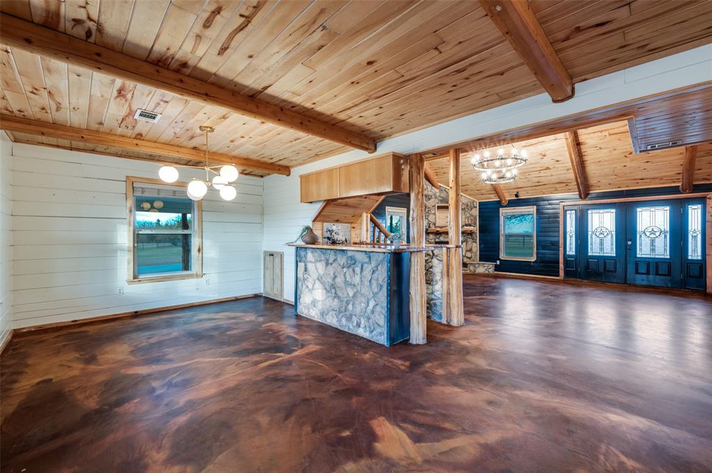 1353 Spring Creek Road Collinsville, TX 76233 - Photo 9 of 40 a view of a porch with wooden floor and roof