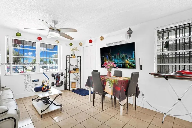 a view of a livingroom with furniture and a floor to ceiling window