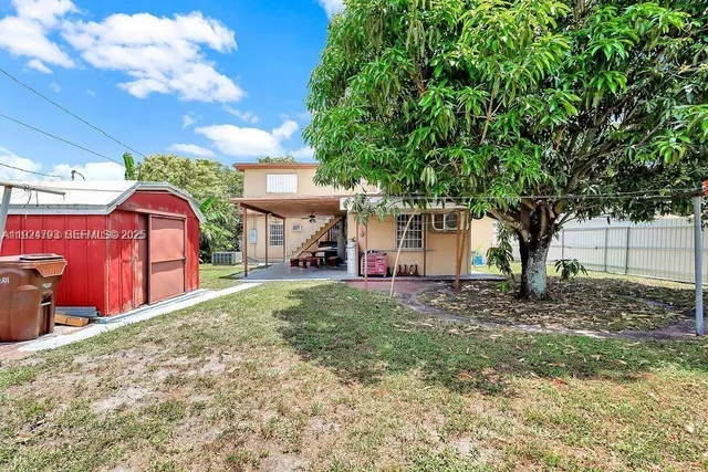 a view of a backyard with a patio
