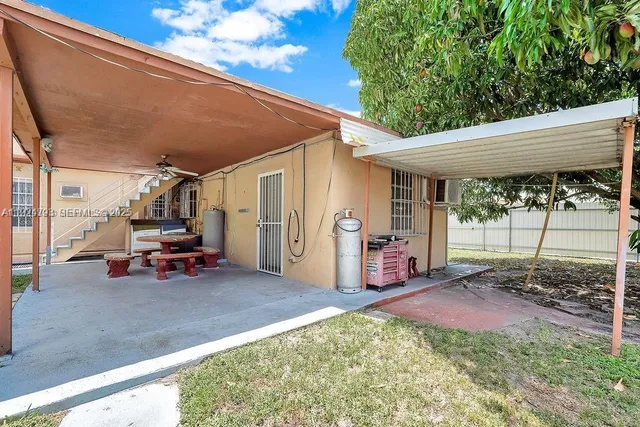a view of a backyard with a garden and plants