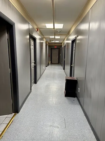 a view of a hallway with stairs