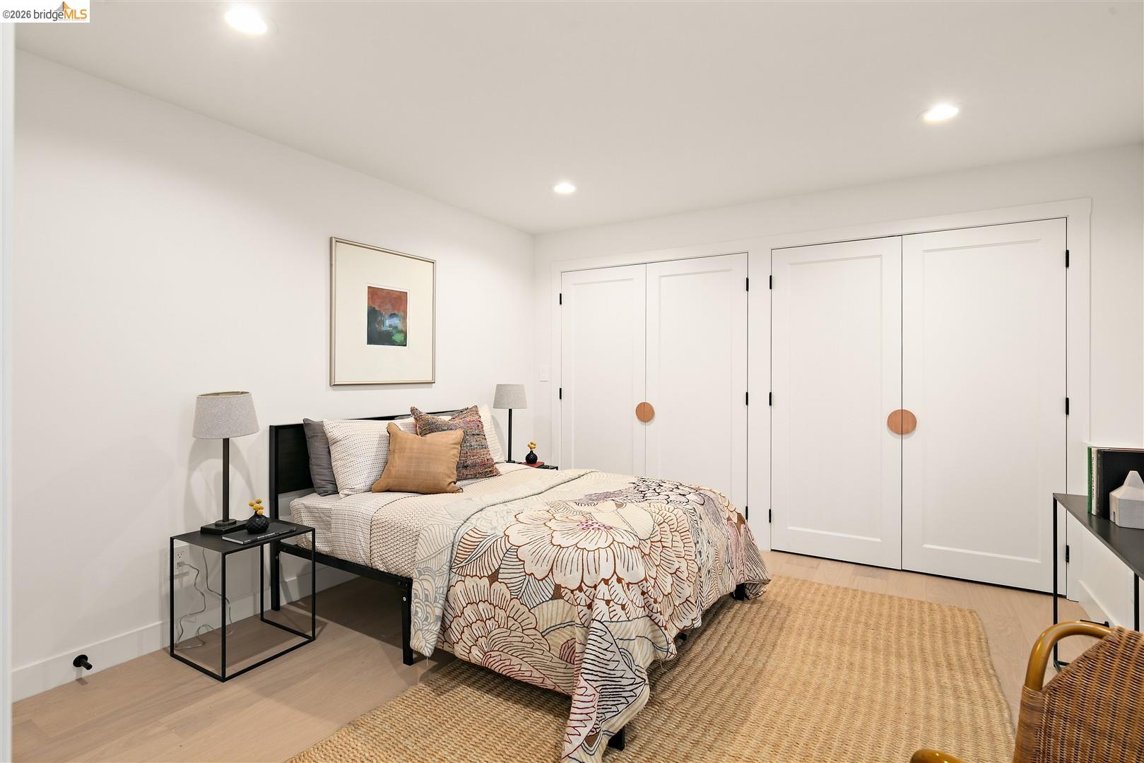 1668 Arch Street Berkeley, CA 94709 - Photo 44 of 78 Recessed lighting, light-toned wood-finish flooring, and white walls