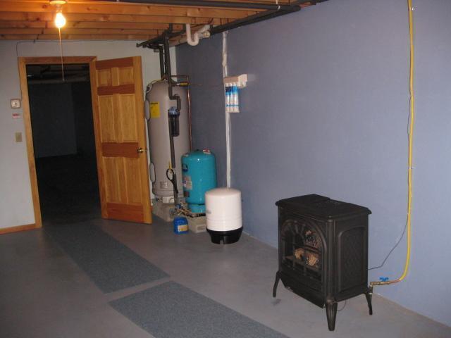 407 Windsor Road South China, ME 04358 - Photo 14 of 17 Basement. Propane stove in basement