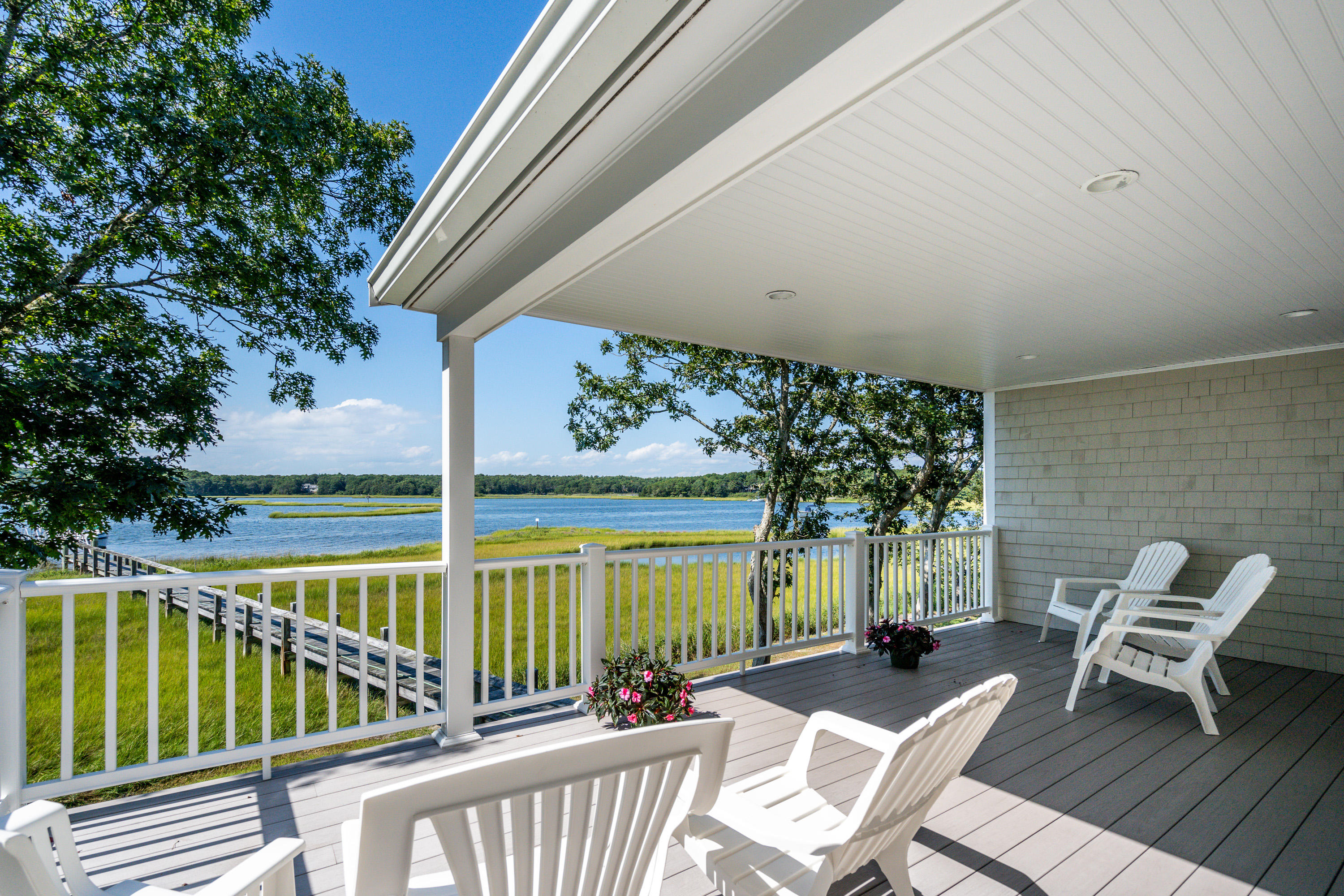 a view of a chairs and table in the balcony