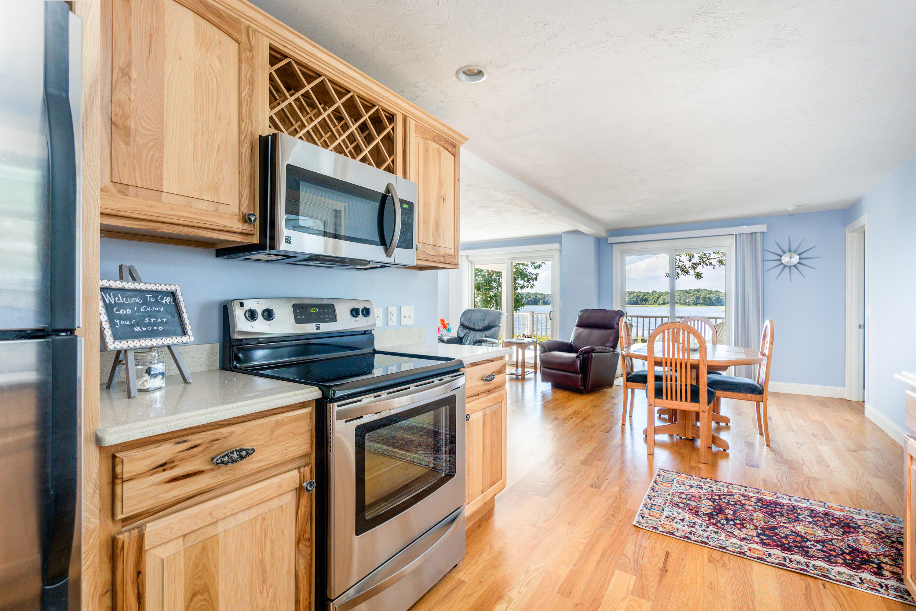 17 Monomoscoy Road West Mashpee, MA 02649 - Photo 12 of 36 a kitchen with stainless steel appliances granite countertop a stove and a refrigerator