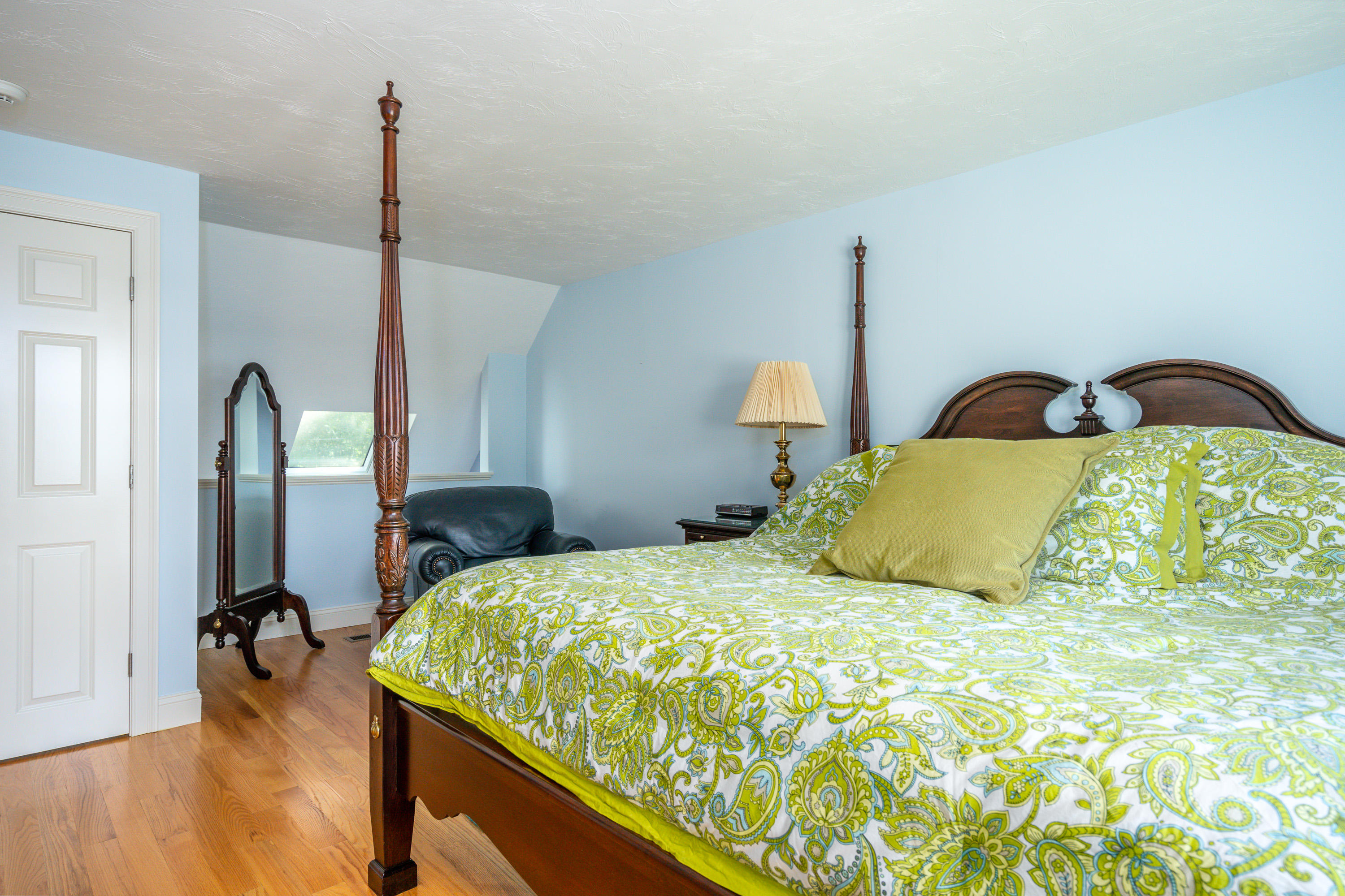 17 Monomoscoy Road West Mashpee, MA 02649 - Photo 18 of 36 a bed sitting in a bedroom next to a window with closet