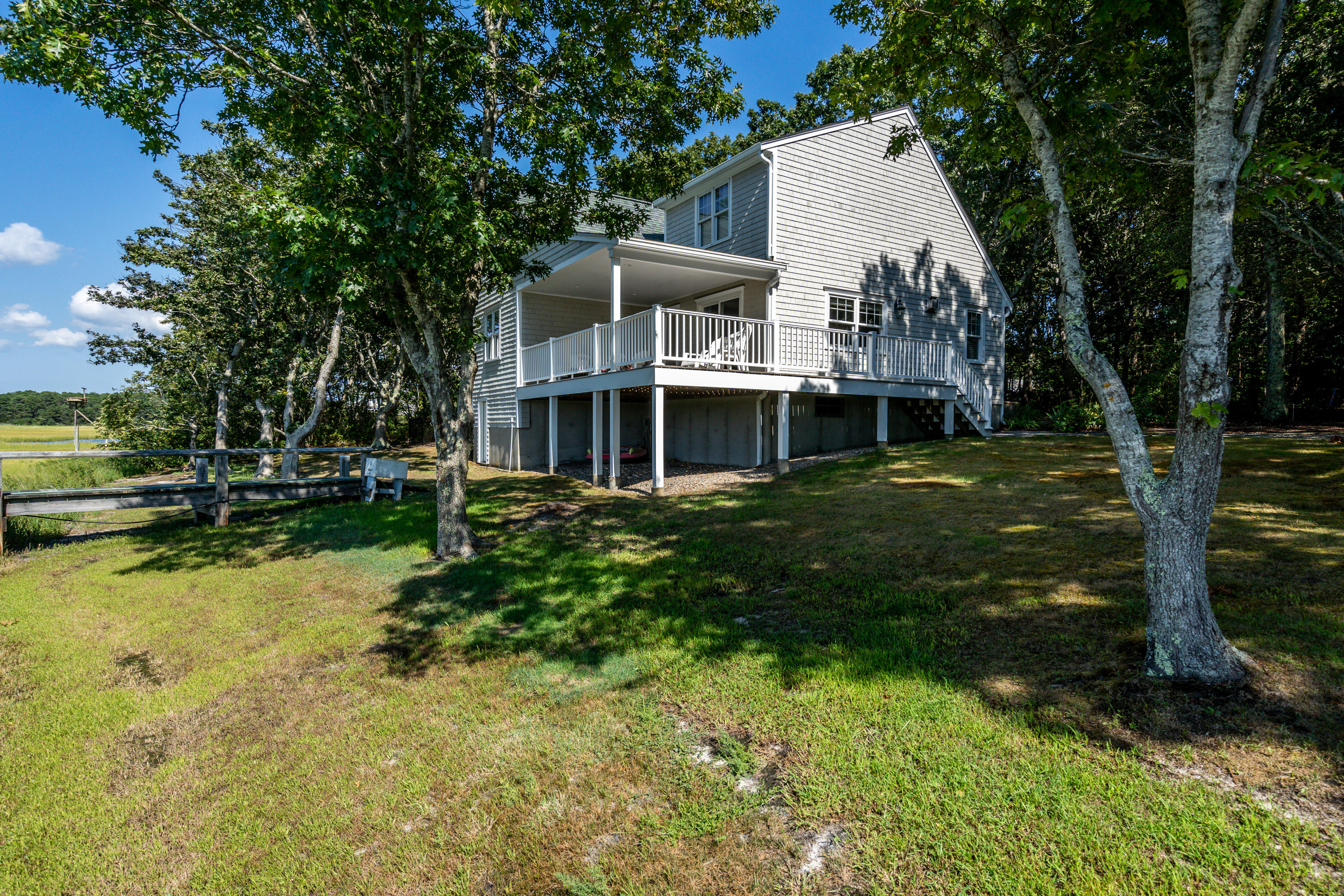 17 Monomoscoy Road West Mashpee, MA 02649 - Photo 21 of 36 a front view of a house with garden