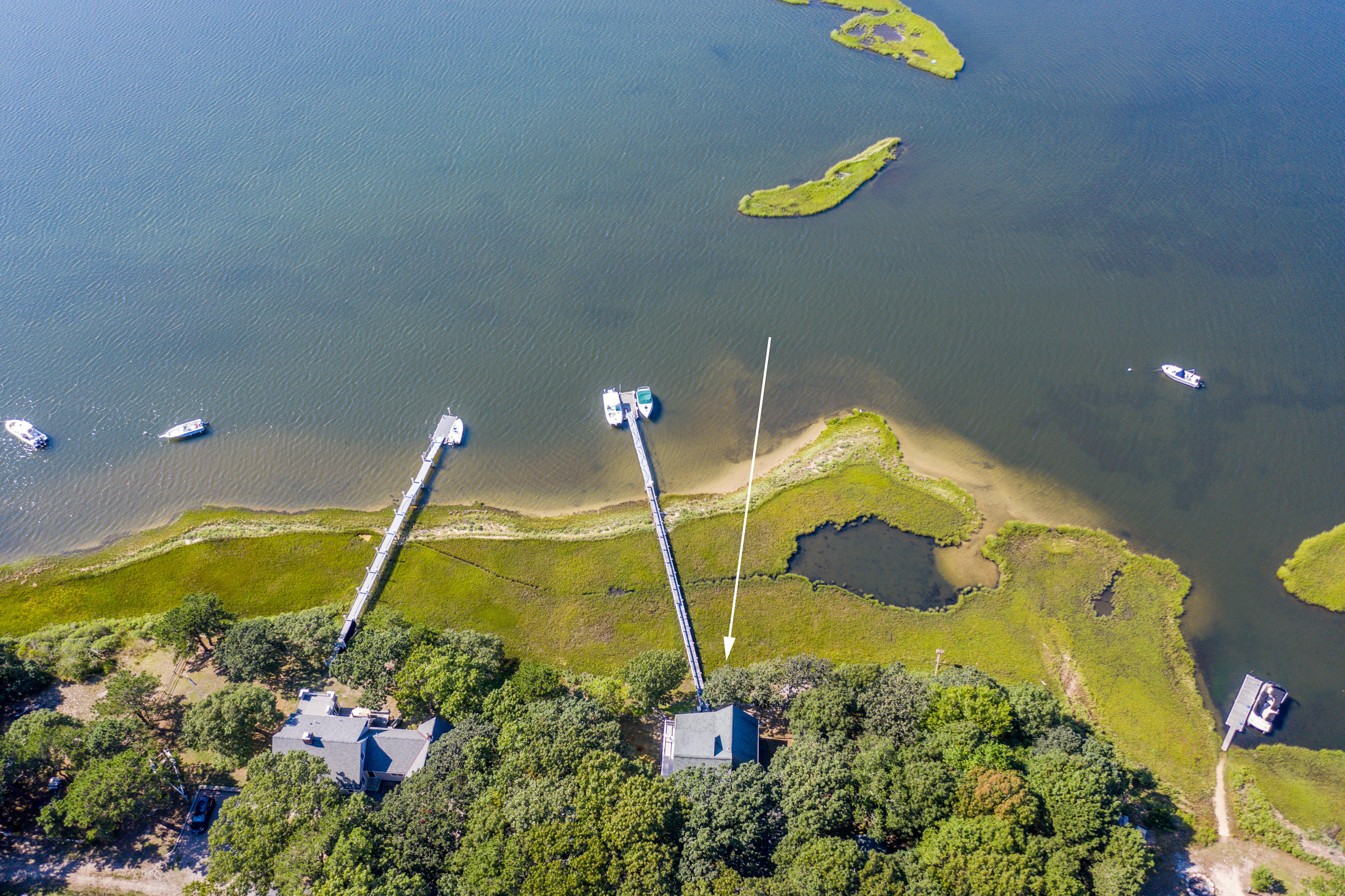 17 Monomoscoy Road West Mashpee, MA 02649 - Photo 25 of 36 a bathroom with a sink and mirror