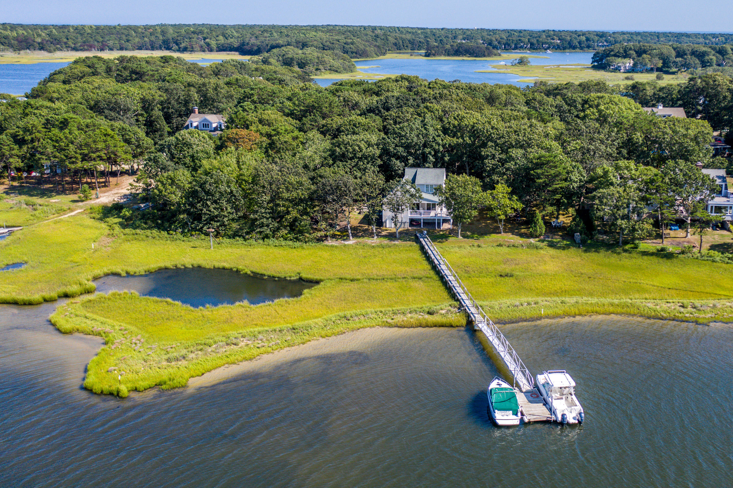 17 Monomoscoy Road West Mashpee, MA 02649 - Photo 28 of 36 a view of a swimming pool and lake