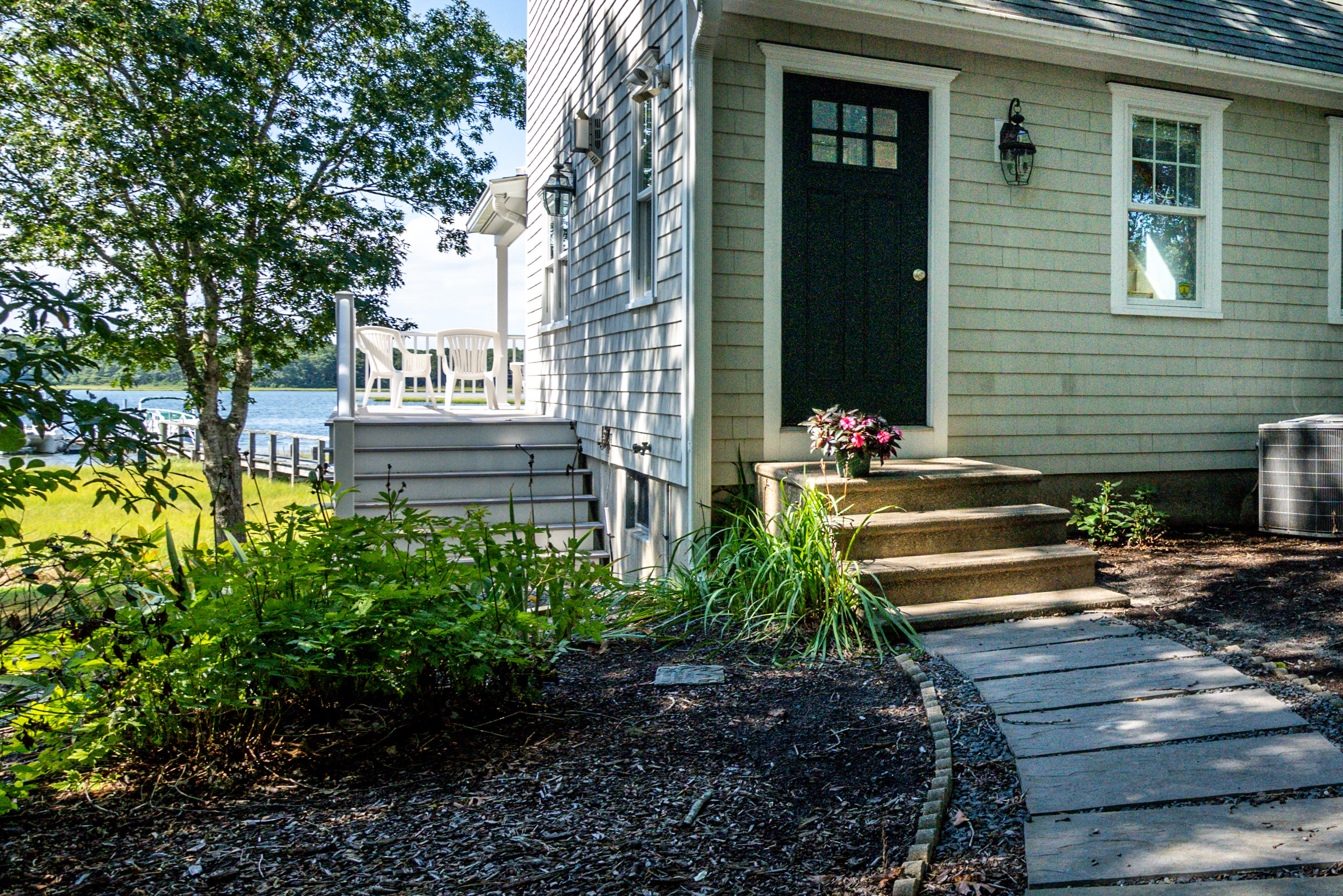 17 Monomoscoy Road West Mashpee, MA 02649 - Photo 30 of 36 a view of a house with a yard