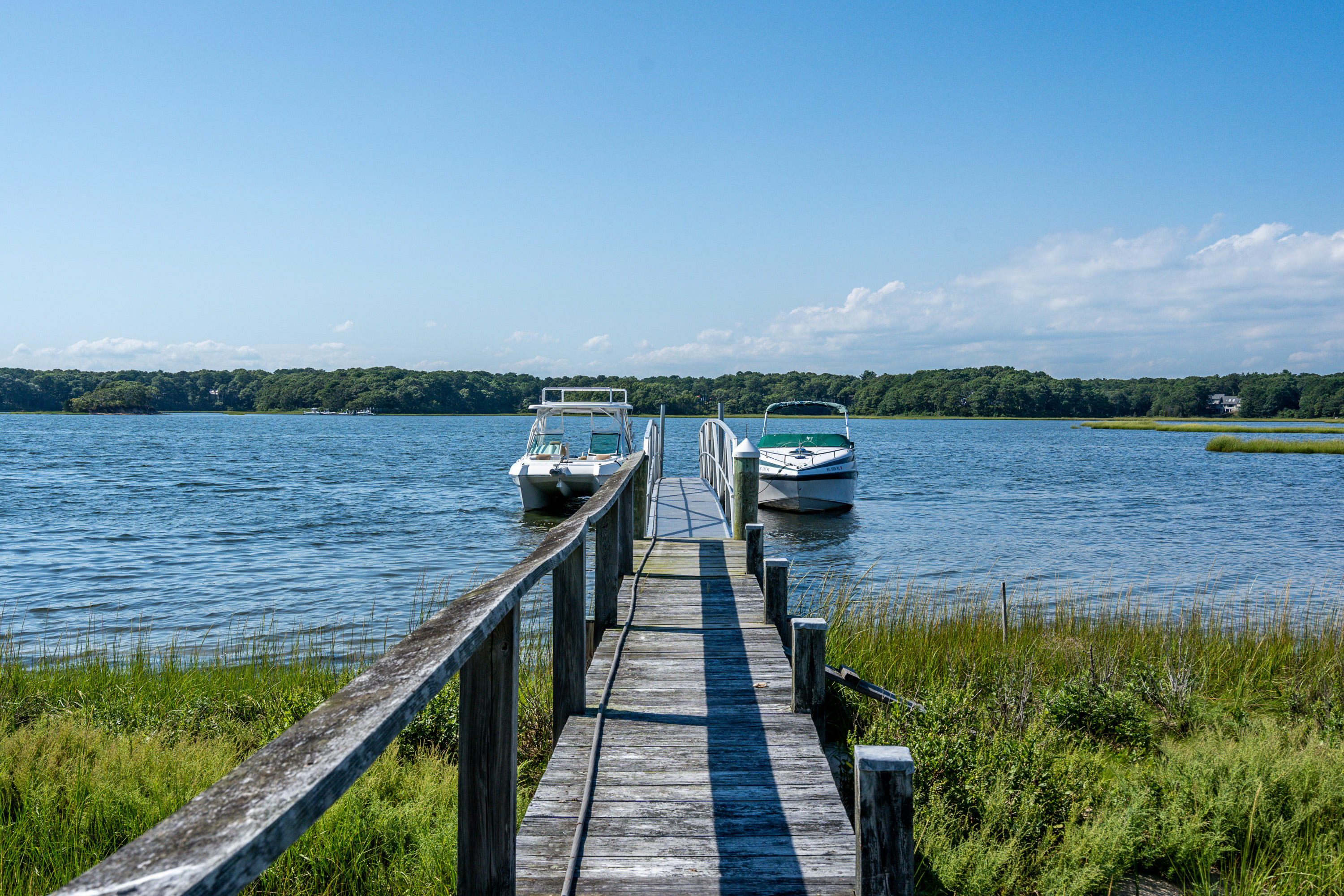 17 Monomoscoy Road West Mashpee, MA 02649 - Photo 4 of 36 a view of a lake with a outdoor space