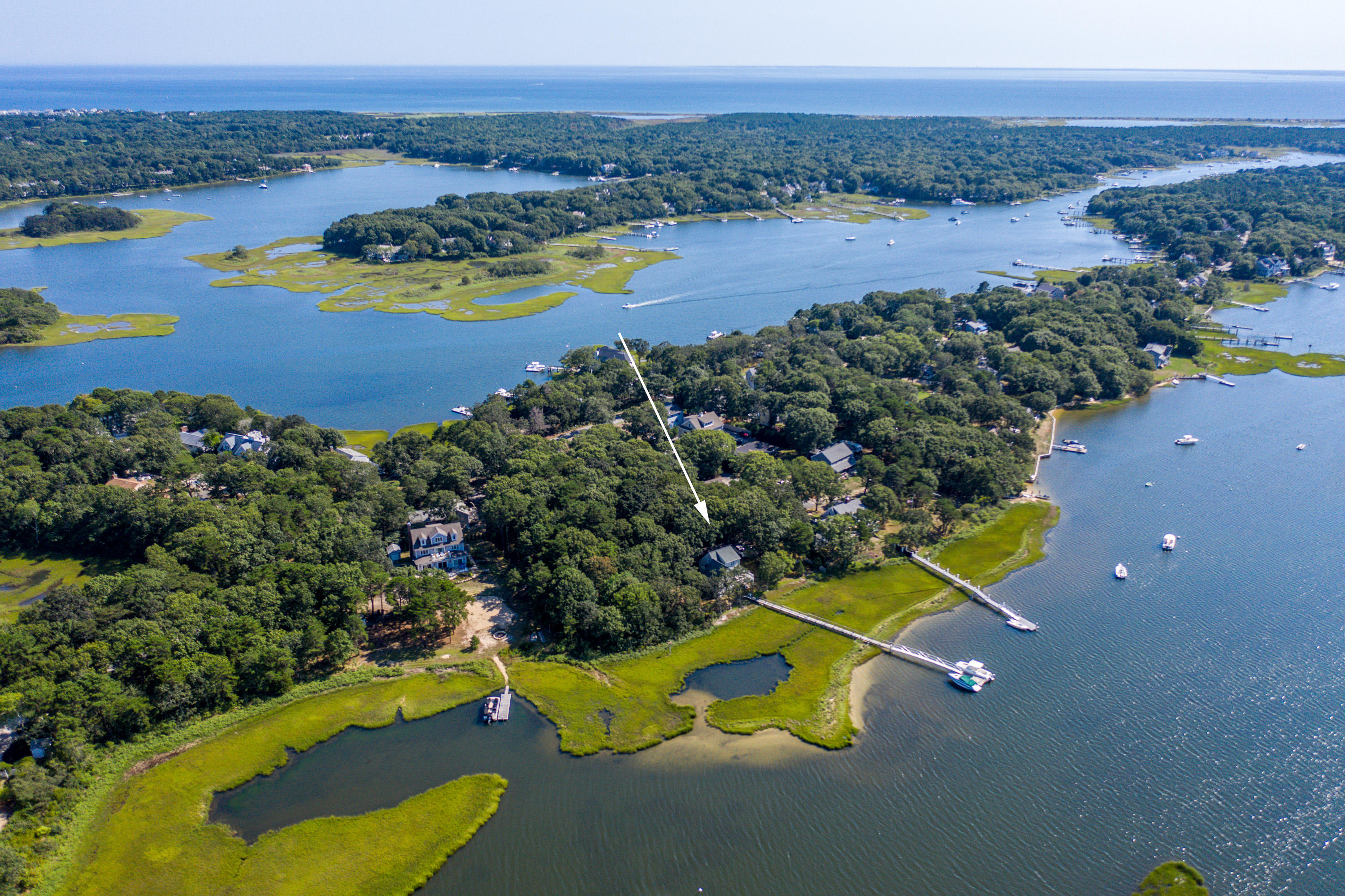 17 Monomoscoy Road West Mashpee, MA 02649 - Photo 5 of 36 an aerial view of a house with a swimming pool outdoor seating and yard