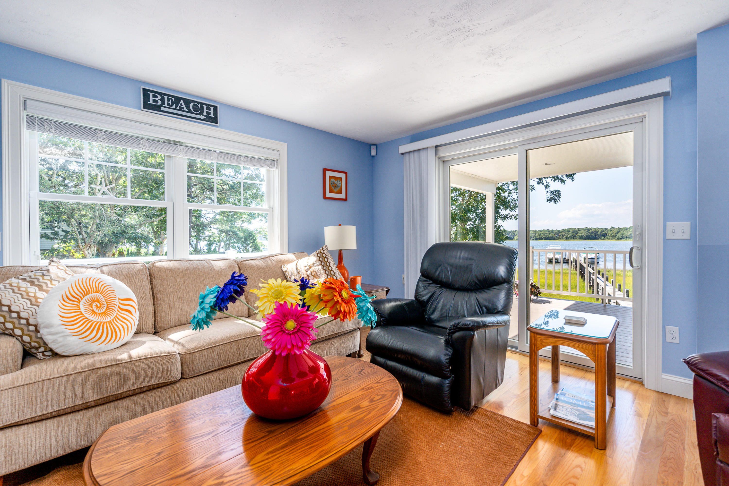 17 Monomoscoy Road West Mashpee, MA 02649 - Photo 7 of 36 a living room with furniture and a large window
