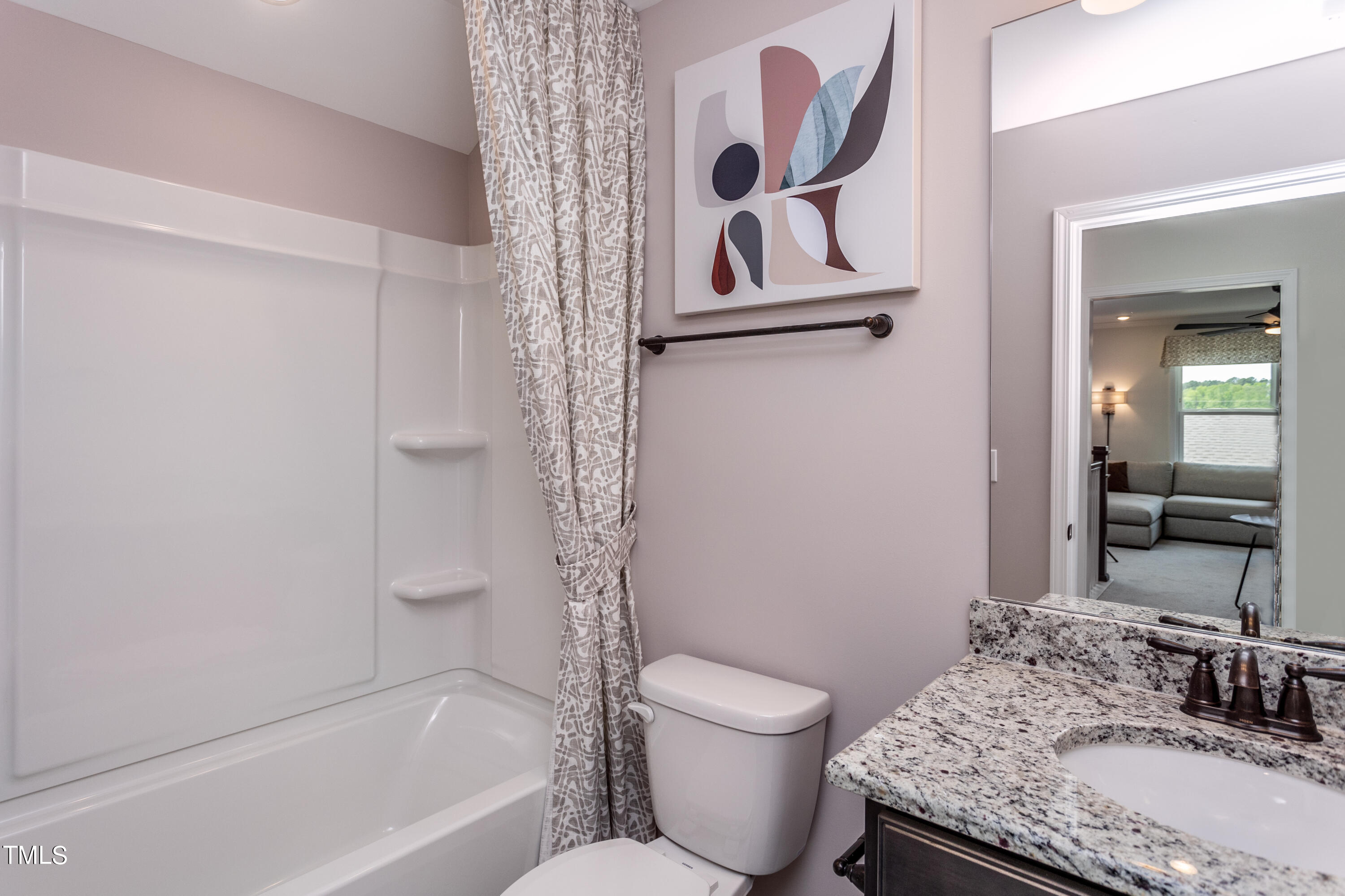 89 Shadowbrook Trail Clayton, NC 27520 - Photo 15 of 17 a bathroom with a granite countertop sink toilet and shower
