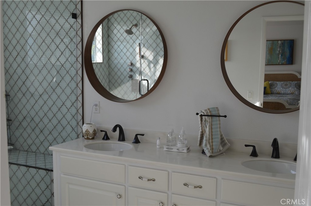 2139 Via Aguila San Clemente, CA 92673 - Photo 17 of 31 a bathroom with a sink and a mirror
