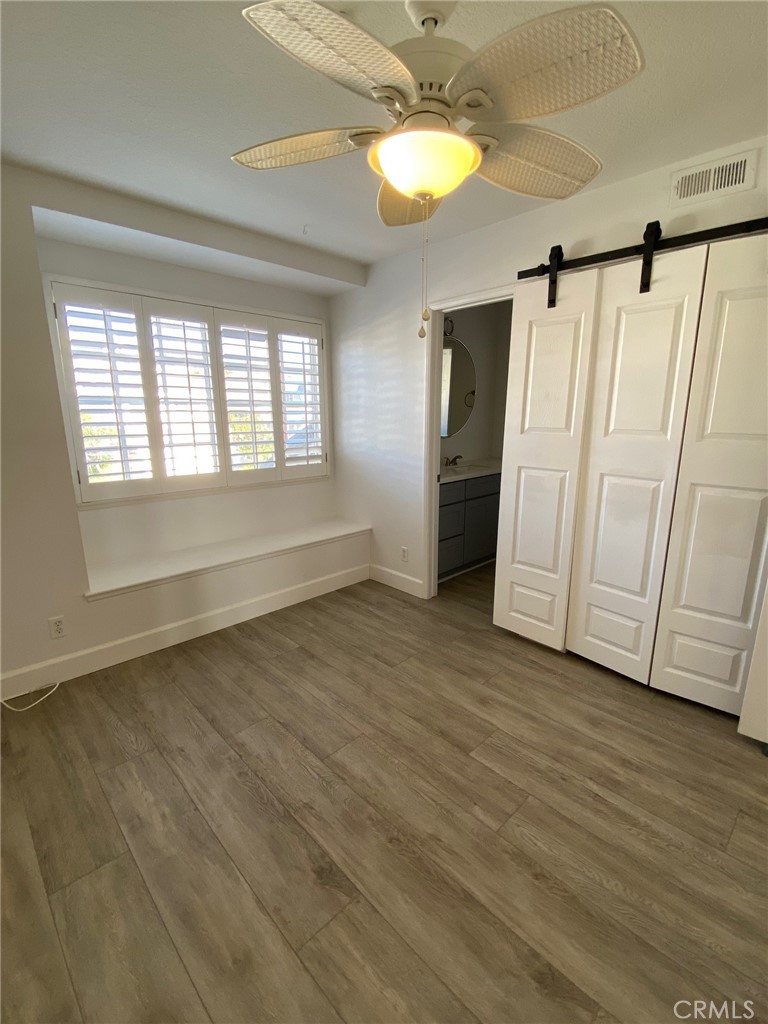 2139 Via Aguila San Clemente, CA 92673 - Photo 20 of 31 an empty room with wooden floor and windows