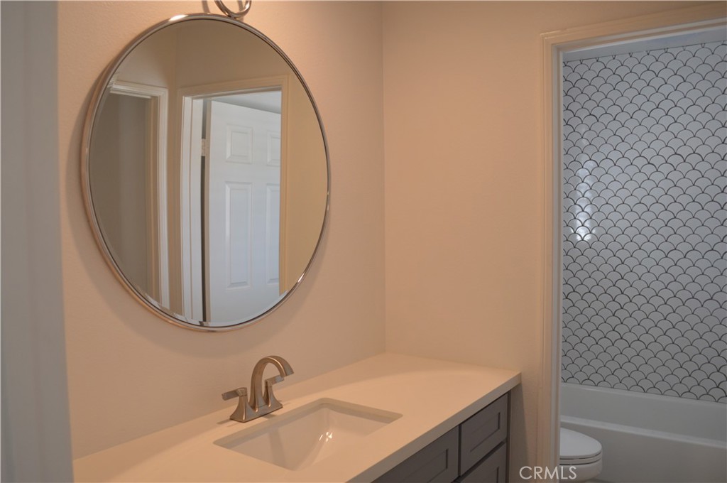 2139 Via Aguila San Clemente, CA 92673 - Photo 21 of 31 a bathroom with a sink a toilet and a mirror
