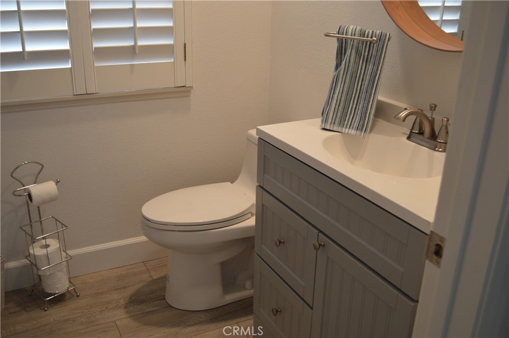 2139 Via Aguila San Clemente, CA 92673 - Photo 24 of 31 a bathroom with a toilet sink and mirror
