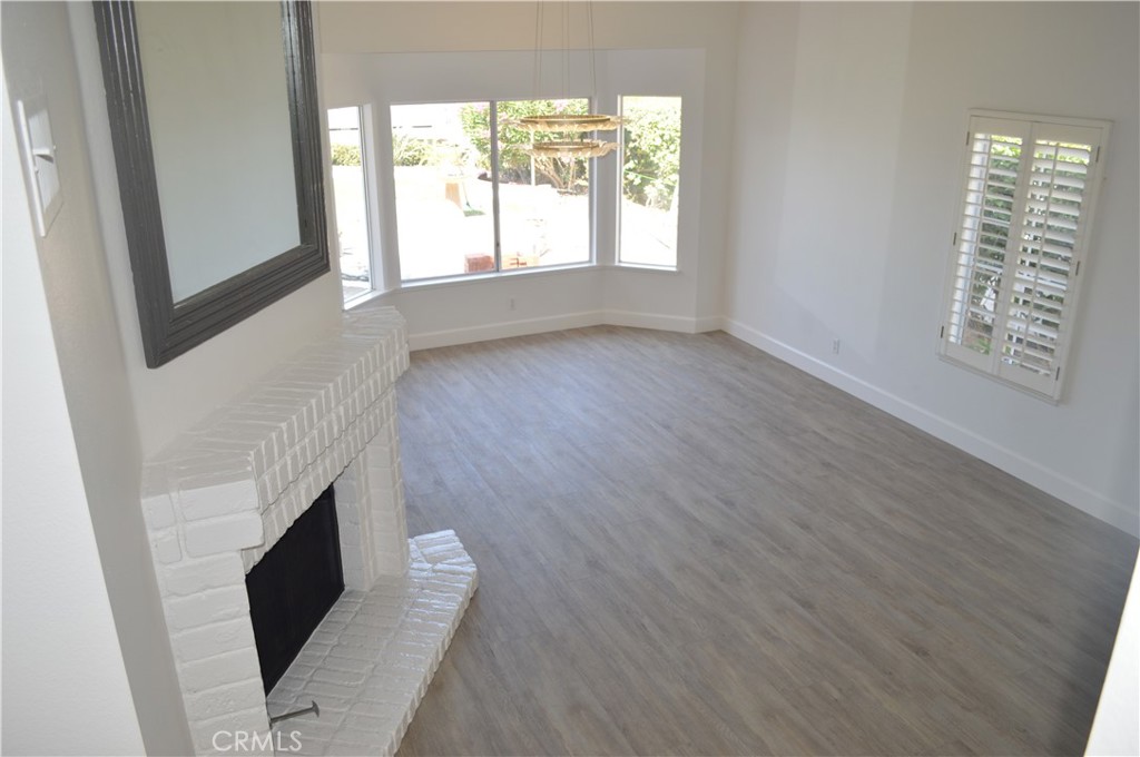 2139 Via Aguila San Clemente, CA 92673 - Photo 5 of 31 an entryway of a house with wooden floor and windows
