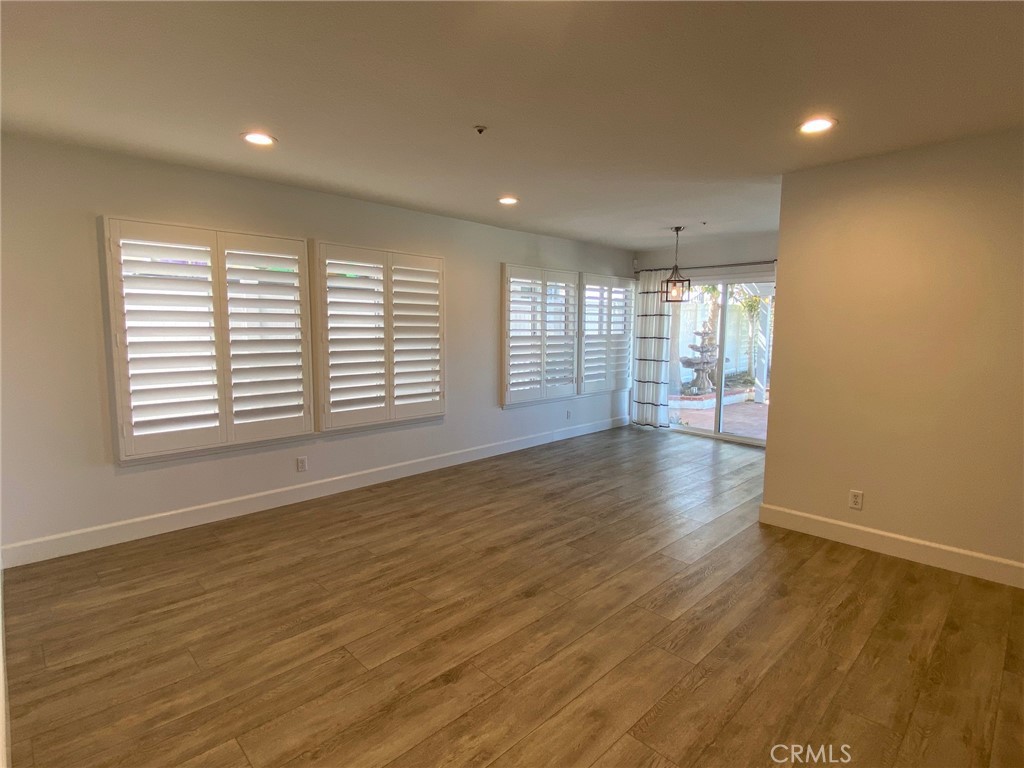 2139 Via Aguila San Clemente, CA 92673 - Photo 9 of 31 an empty room with wooden floor and windows