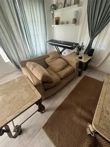 a view of a balcony with furniture