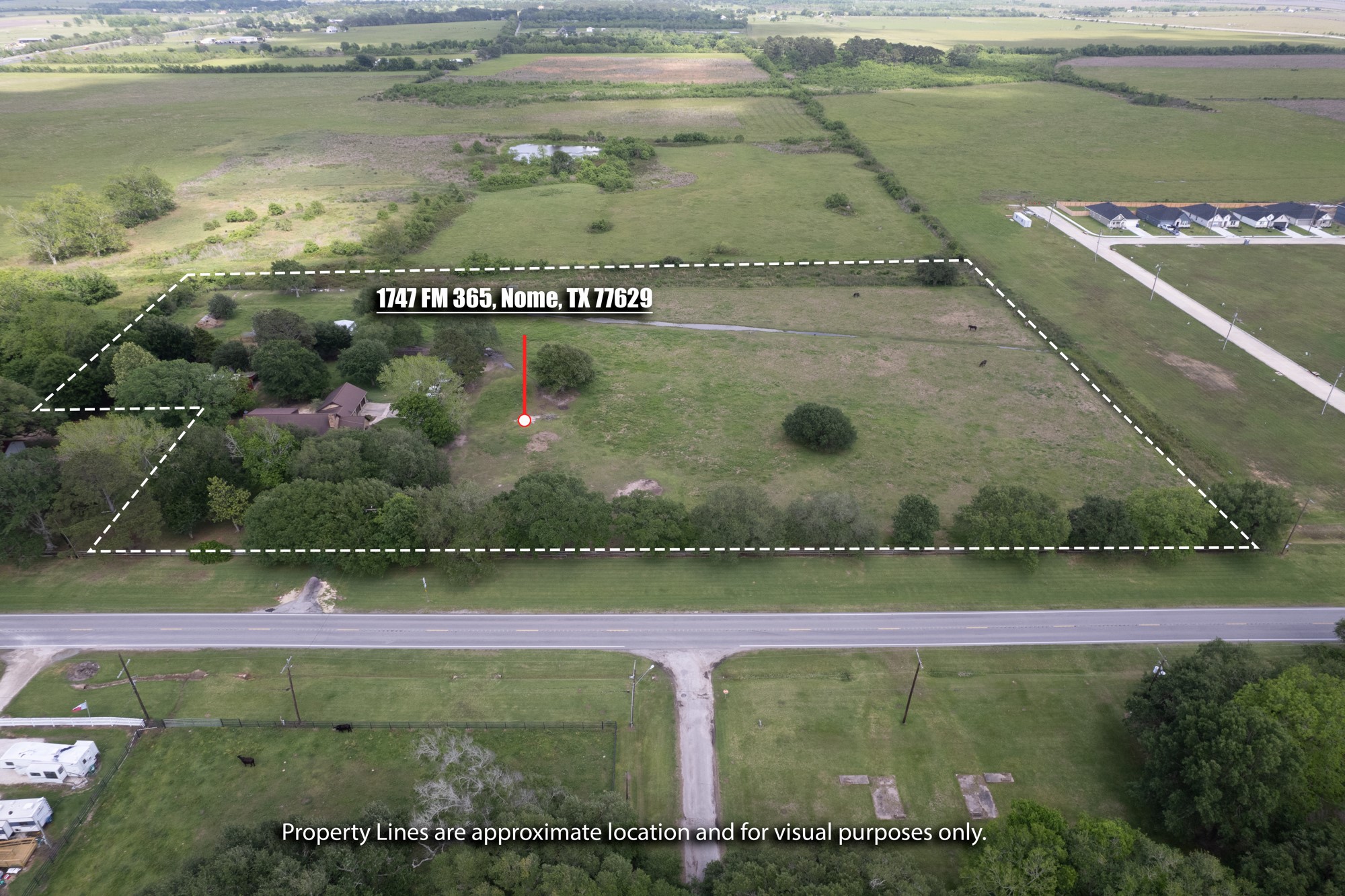 1747 Farm To Market Road 365 Nome, TX 77629 - Photo 23 of 24 a view of a water pond with an outdoor seating