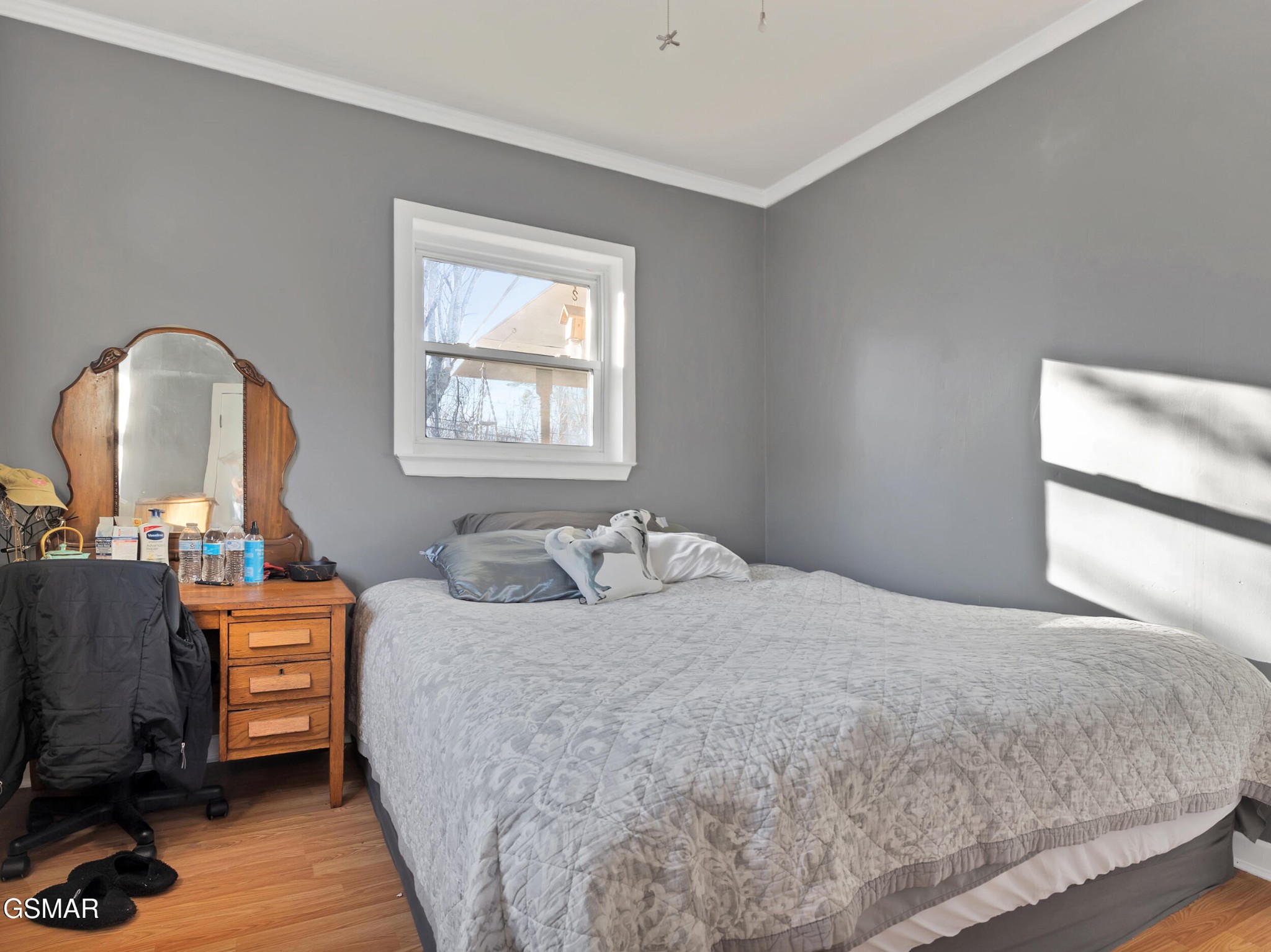 540 Carson Springs Road Newport, TN 37821 - Photo 12 of 32 a bedroom with a bed and a dresser next to a window
