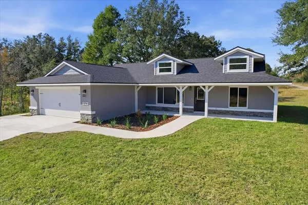 front view of a house with a yard