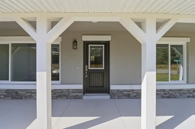 a front view of a house with glass door