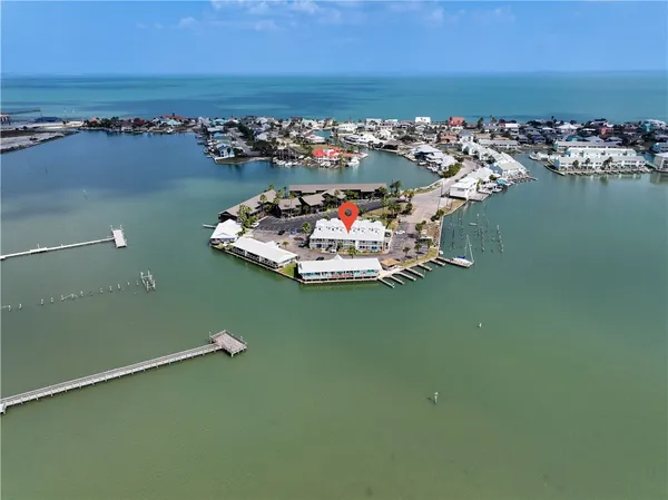 an aerial view of a residential houses with outdoor space