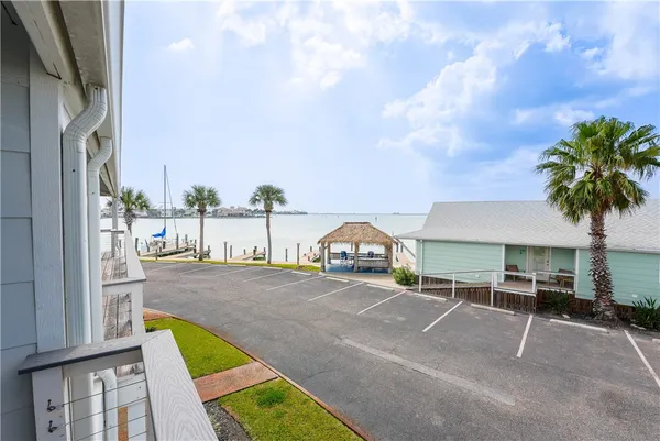 an outdoor space with swimming pool and furniture