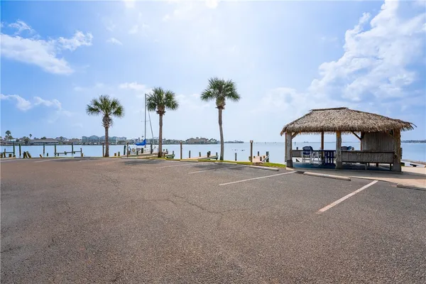 a front view of a house with swimming pool having outdoor seating