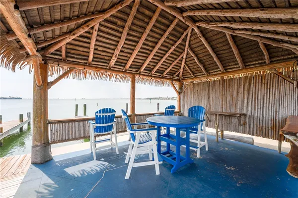 a view of a lake with chairs