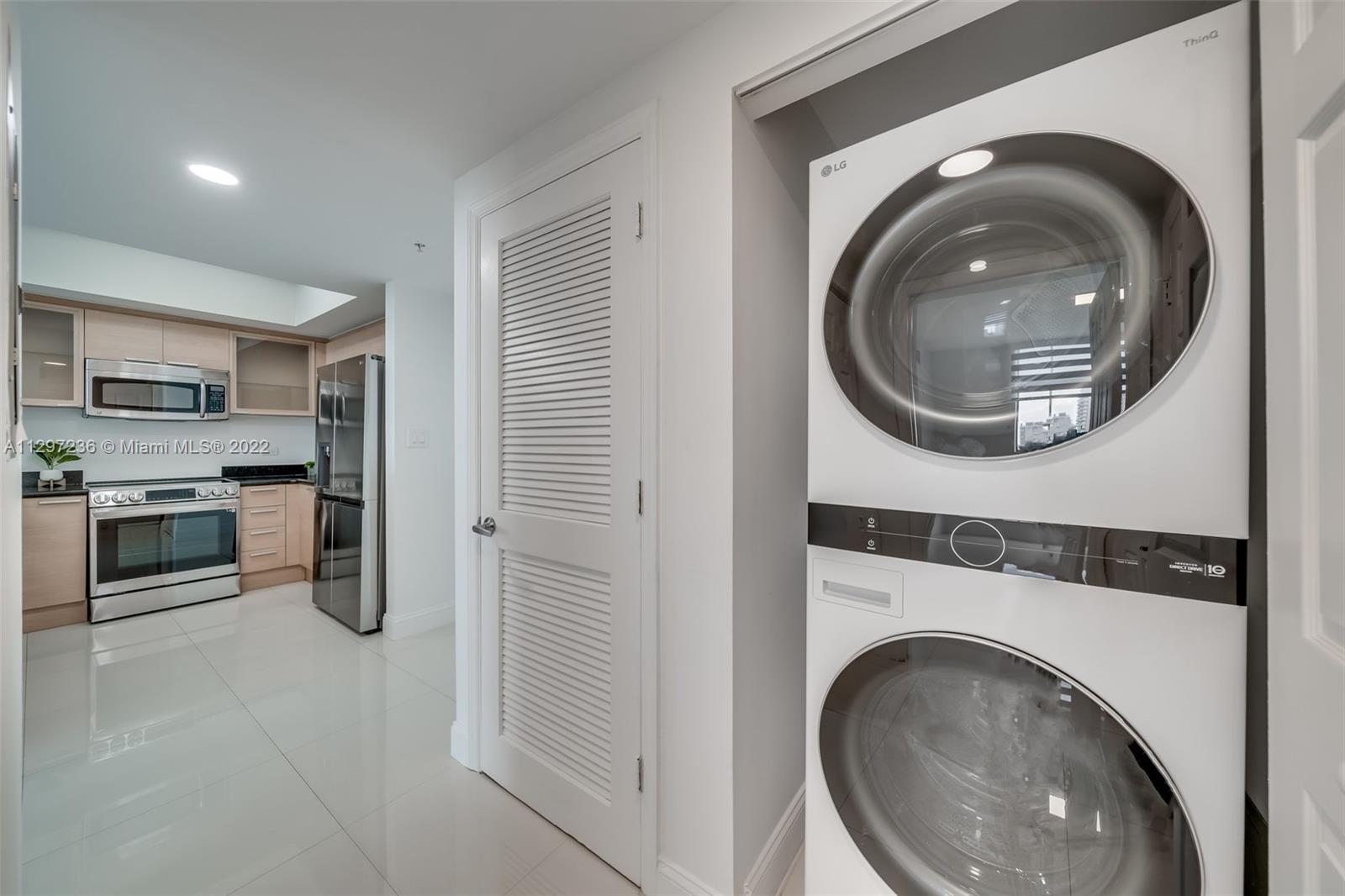 a kitchen with a washer and dryer